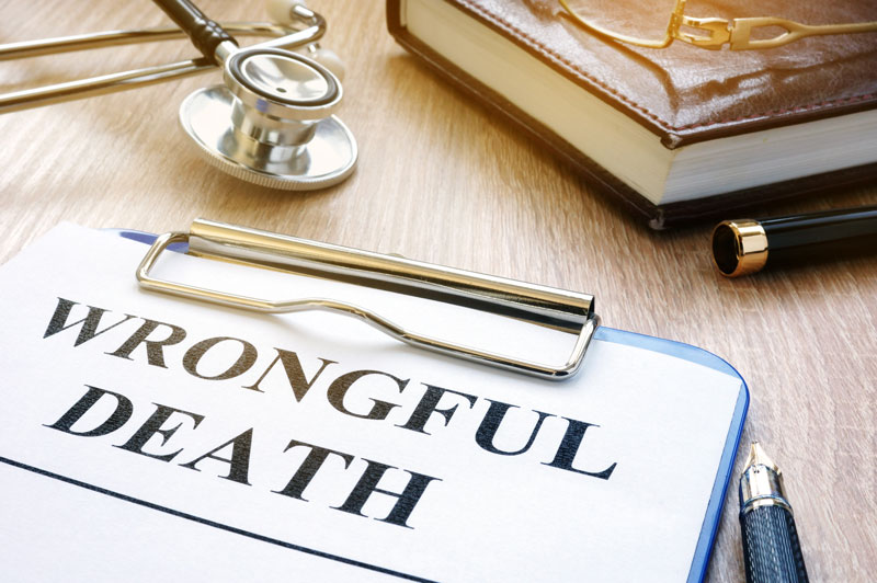 Wrongful death form and stethoscope on a table